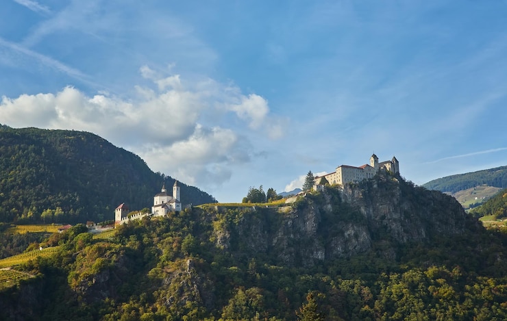 Free Photo idyllic rural landscape with a castle and vineyards merano italy
