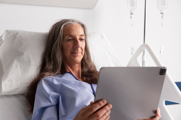 Ill female patient in bed at the hospital