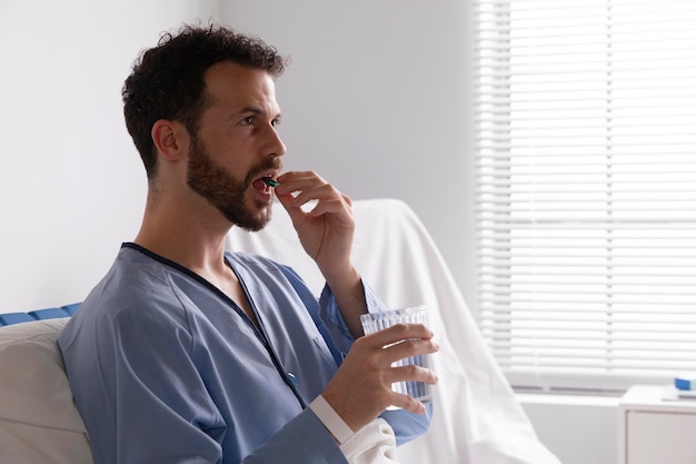 Ill male patient in bed at the hospital