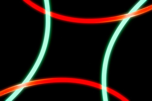 Illuminated red and green curve lights on black background