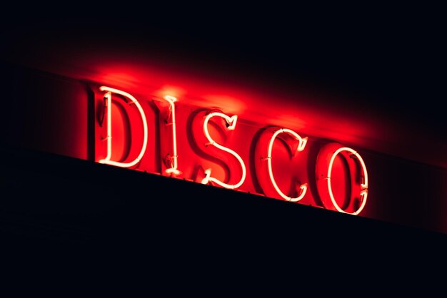 Illuminated red signboard of Disco