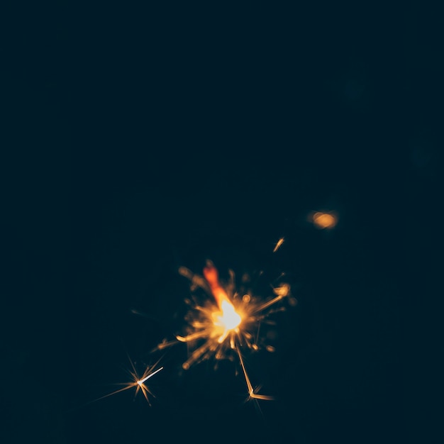 Illuminated sparks on dark background