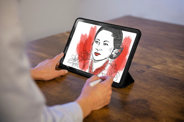 Free photo illustrator drawing on the ipad side view