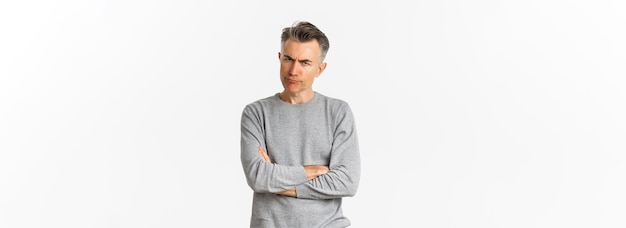 Free photo image of angry and disappointed middleaged man being offended or displeased frowning and grimacing c