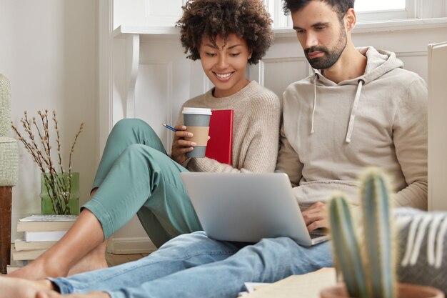 Image of family couple choose items for home in internet web store