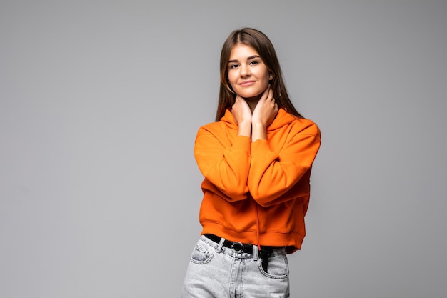 Image of happy young business woman posing isolated on grey wall.