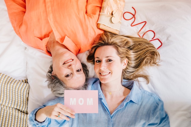 Free photo image of mother and daughter on bed