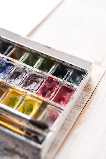 image of paint buckets and brushes isolated