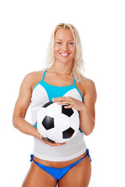 Image of woman with ball posing in studio