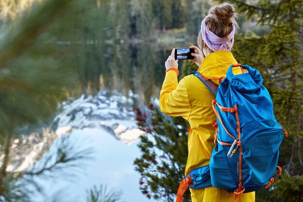 Image of young hipster girl wears yellow anorak