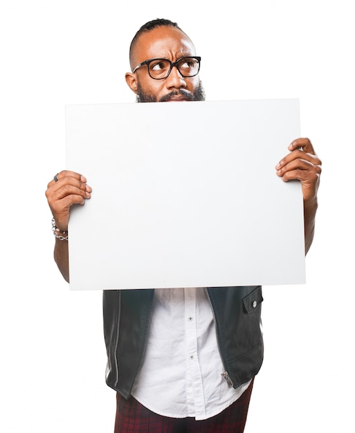 Free photo imaginative guy with an empty signboard