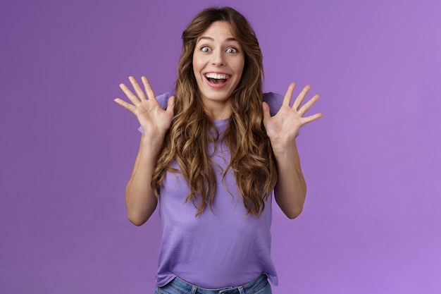 Impressed excited enthusiastic attractive lively girl celebrating good news gesturing shaking hands thrill joy smiling broadly found out great perfect event grinning joyfully purple background