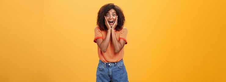 Free Photo impressed talkative african american woman finding out hot details of rumor being excited thrilled l