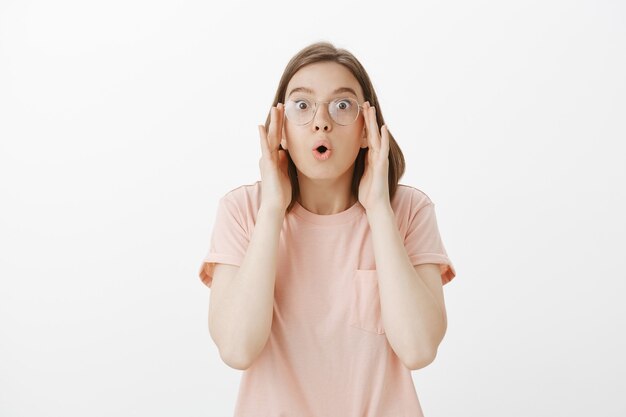 Impressed woman put on glasses and finally can see