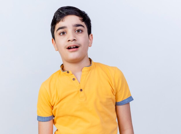 Impressed young caucasian boy looking at camera isolated on white background with copy space