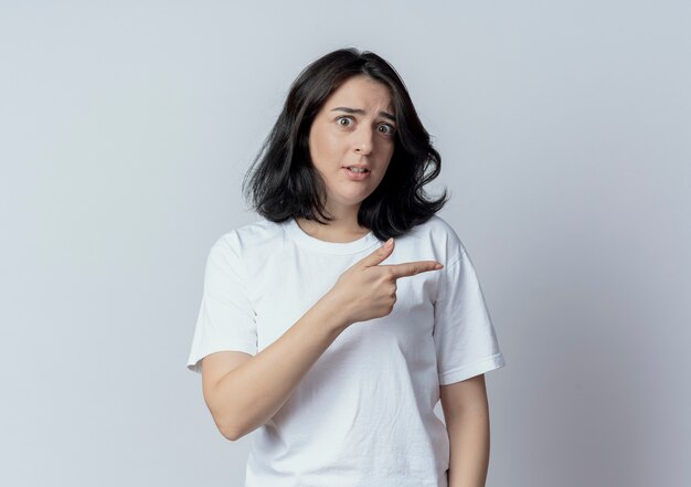 Free photo impressed young pretty caucasian girl pointing at side isolated on white background with copy space