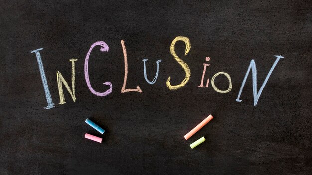 Inclusion word written in colourful chalk