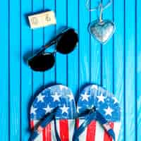 Free photo independence day composition with flip flops