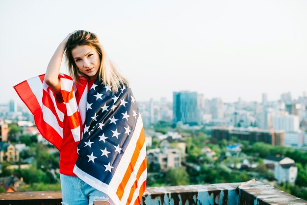 Independence day concept with girl on rooftop