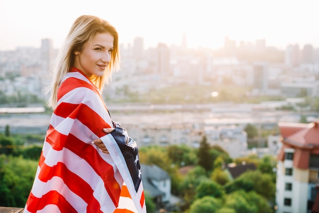 Independence day concept with girl on rooftop