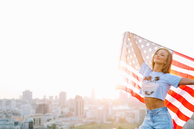 Independence day concept with girl on rooftop