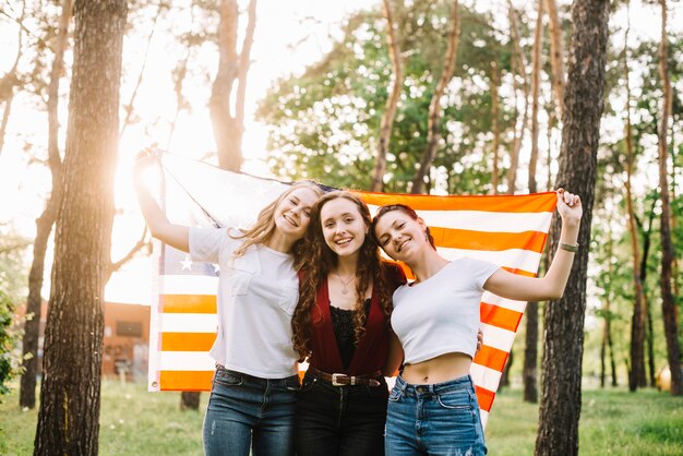 Independence day concept with happy girls in forest