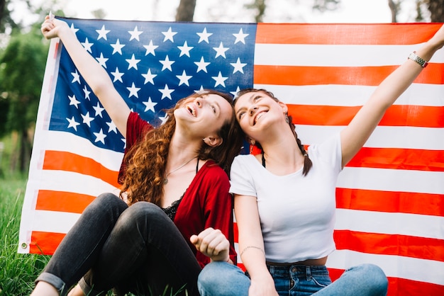 Free photo independence day concept with two girls in nature