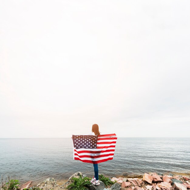 Independence day concept with woman at the sea