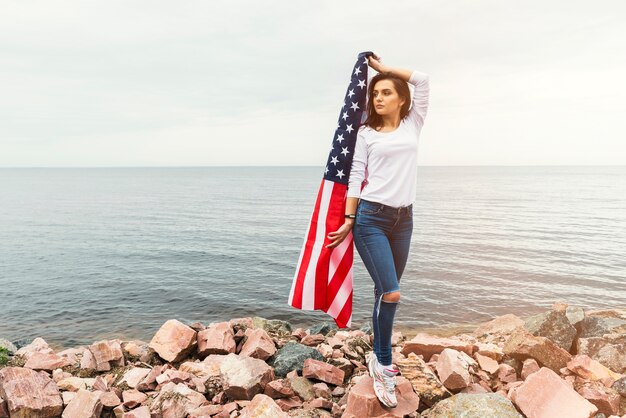 Independence day concept with woman at the sea