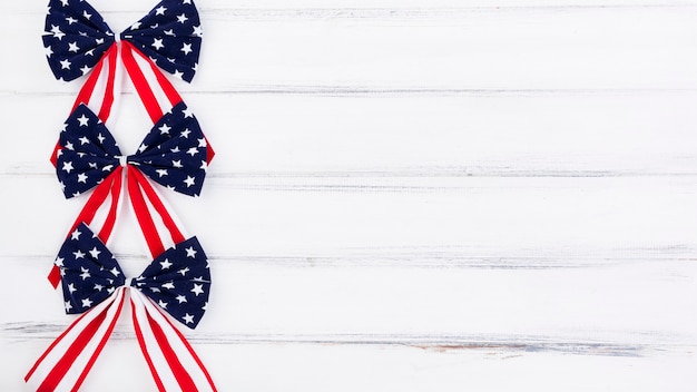 Free photo independence day flag bows in red white and blue stars