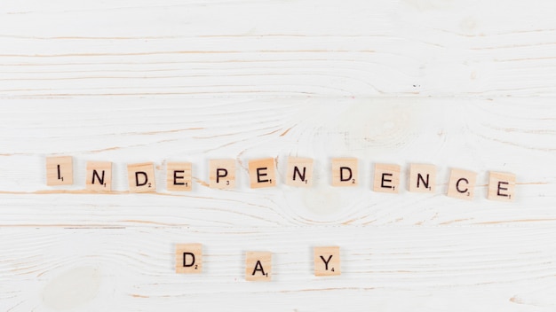 Independence day in letters on wooden surface