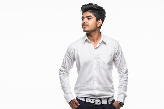 Indian business man with crossed hands posing, isolated on a white wall