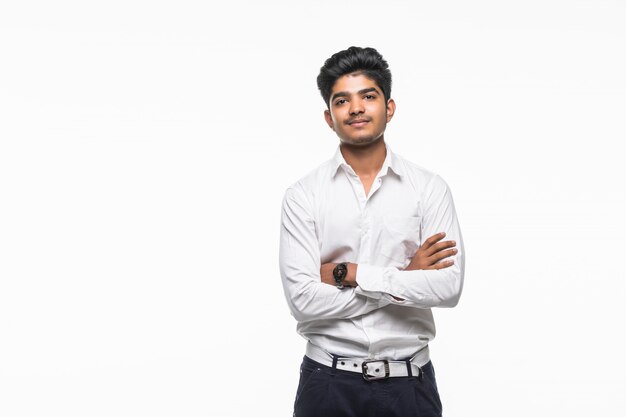 Indian business man with crossed hands posing, isolated on a white wall