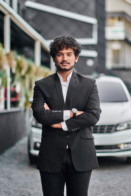 Indian businessman near his car