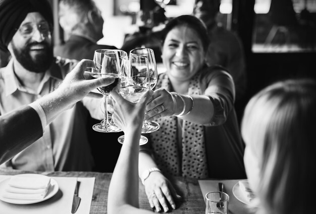 Indian couple making a toast with their friends