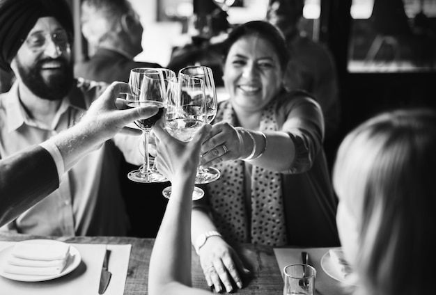 Indian couple making a toast with their friends