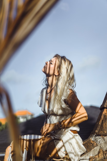 Indian girl on the roof. Dream catchers. beautiful blonde girl with dream catchers.