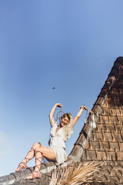 Indian girl on the roof. Dream catchers. beautiful blonde girl with dream catchers.