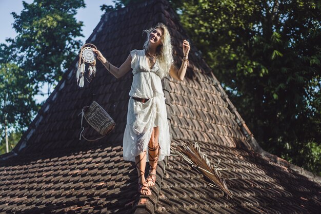 Indian girl on the roof. Dream catchers. beautiful blonde girl with dream catchers.