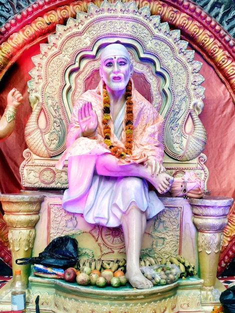 Indian hindu god shirdiwale sai baba blessing stone idol in hindu spiritual temple, regarded by his devotees as a saint.