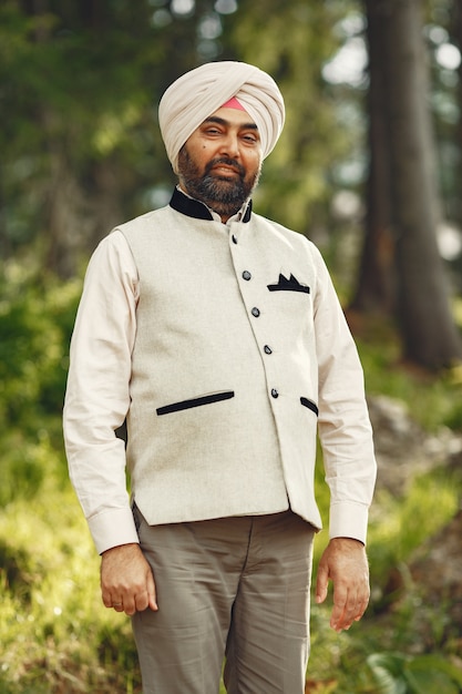 Indian man in a mountains. Male in a traditional turban. Hinduist.