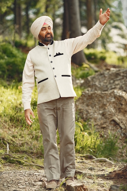 Indian man in a mountains. Male in a traditional turban. Hinduist.