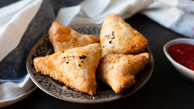 Indian traditional patisserie with sauce