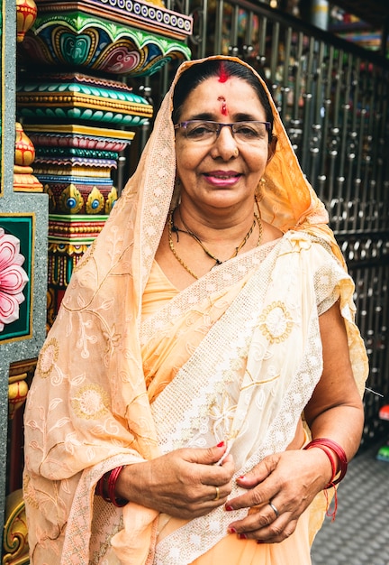 Free photo indian woman portrait at the temple