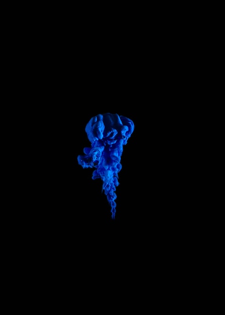 Indigo blue droplet in water