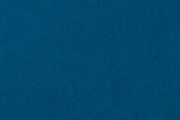 Синий индиго однотонный текстурированный фон с принтами на ткани