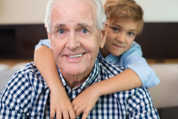 indoor old boy grandparent embracing