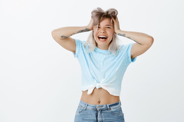 Indoor shot of blonde girl posing in the studio