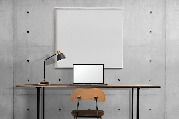 Бесплатное фото Дизайн интерьера промышленного домашнего офиса с белой рамкой, висящей на стене