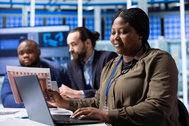 industrial plant researchers use notebook for research and development analysis